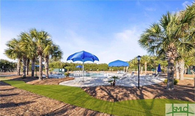 901 Garden Hills Loop, Richmond Hill, GA 31324 - view of community featuring a patio and a swimming pool