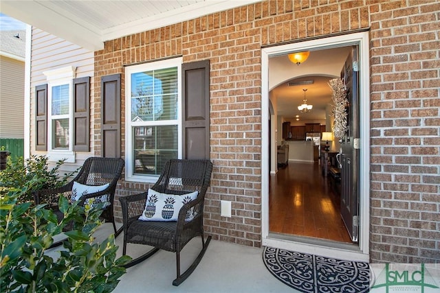 901 Garden Hills Loop, Richmond Hill, GA 31324 - entrance to property with covered porch and brick siding