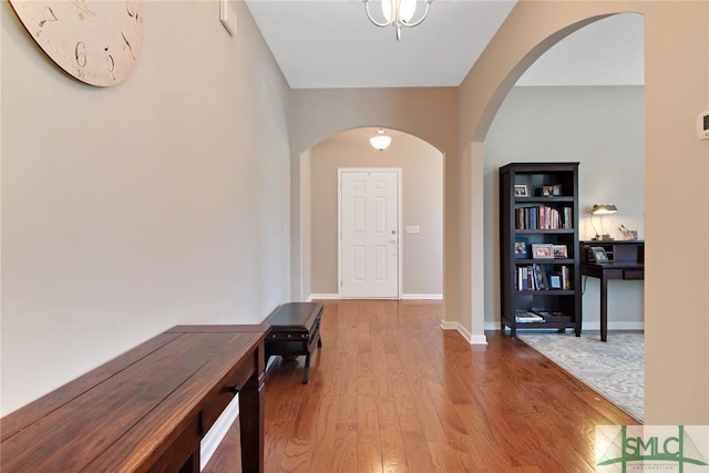 901 Garden Hills Loop, Richmond Hill, GA 31324 - entryway with arched walkways, wood finished floors, and baseboards