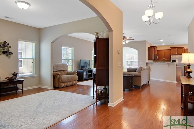 901 Garden Hills Loop, Richmond Hill, GA 31324 - living area featuring arched walkways, wood finished floors, and ceiling fan