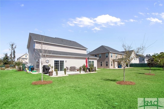 901 Garden Hills Loop, Richmond Hill, GA 31324 - rear view of house featuring a patio area and a lawn
