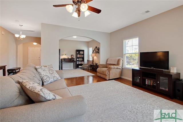 901 Garden Hills Loop, Richmond Hill, GA 31324 - living area with arched walkways, a ceiling fan, and wood finished floors