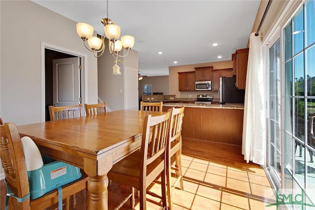 901 Garden Hills Loop, Richmond Hill, GA 31324 - dining room featuring plenty of natural light, a chandelier, recessed lighting, and light tile patterned floors