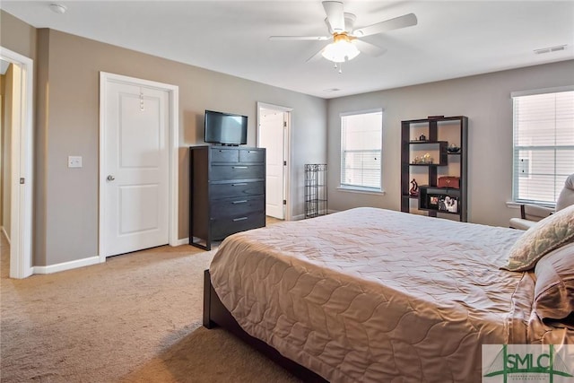 901 Garden Hills Loop, Richmond Hill, GA 31324 - bedroom featuring light carpet, baseboards, and ceiling fan