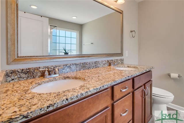 901 Garden Hills Loop, Richmond Hill, GA 31324 - full bathroom with toilet, double vanity, baseboards, and recessed lighting