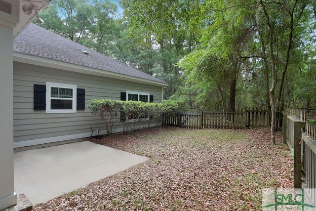 190 Blackjack Oak Dr E, Richmond Hill, GA 31324 - fenced backyard with a patio area