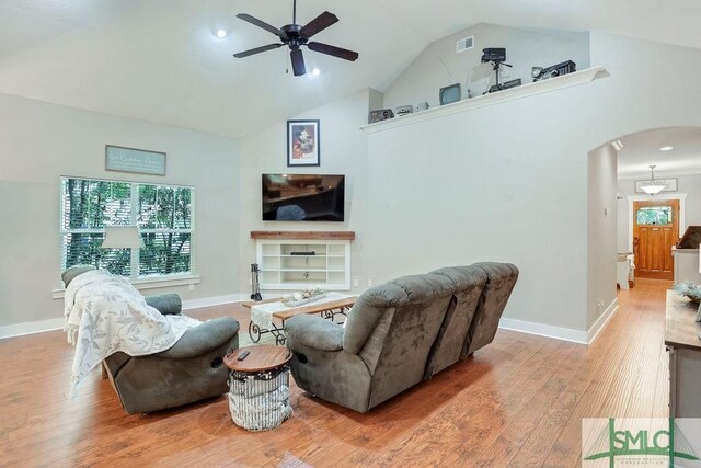 190 Blackjack Oak Dr E, Richmond Hill, GA 31324 - living area with arched walkways, a ceiling fan, wood-type flooring, baseboards, and high vaulted ceiling