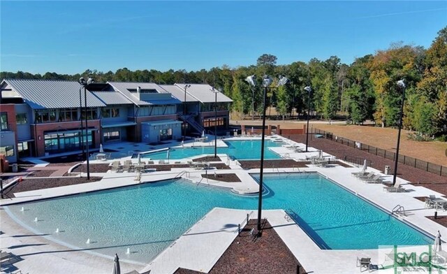 190 Blackjack Oak Dr E, Richmond Hill, GA 31324 - community pool with a patio area and fence