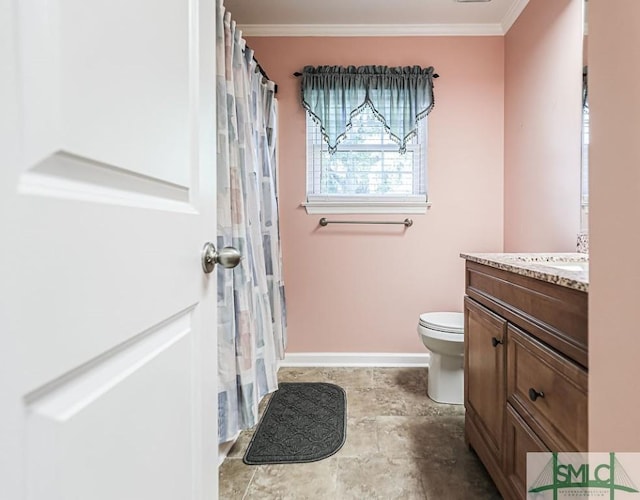 full bathroom featuring ornamental molding, toilet, vanity, and baseboards
