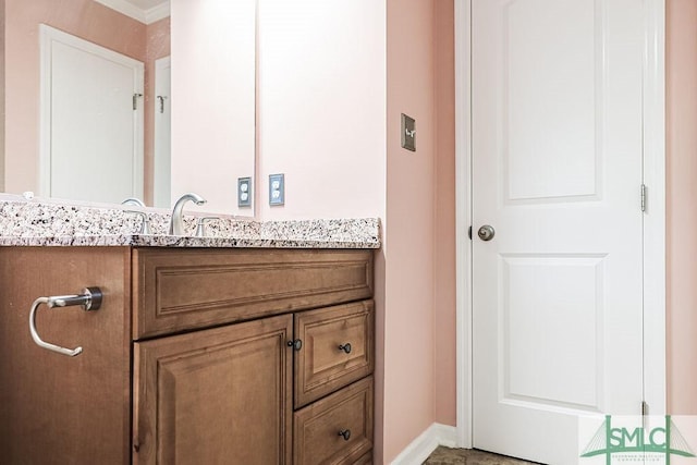 bathroom with vanity and baseboards
