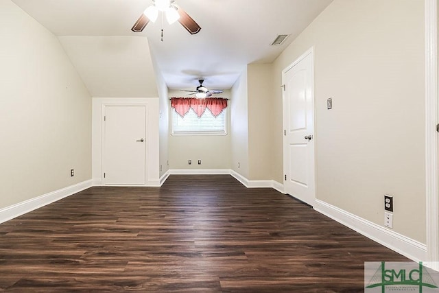 unfurnished room featuring ceiling fan, dark wood-style floors, and baseboards