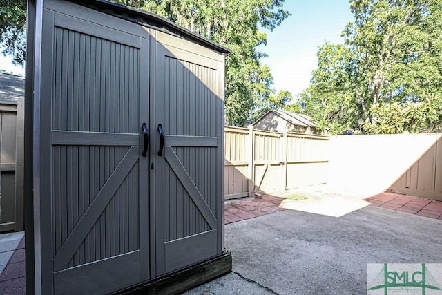 view of shed featuring a fenced backyard