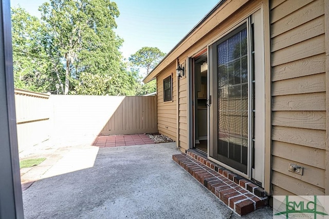 view of patio with a fenced backyard and entry steps