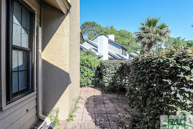 view of side of property with stucco siding