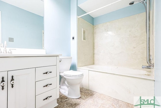 bathroom with toilet, vanity, and bathing tub / shower combination
