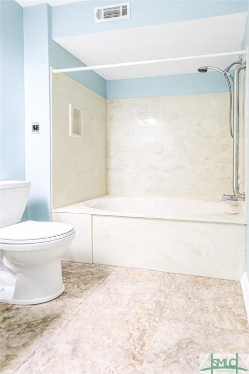 bathroom featuring toilet and shower / bathtub combination