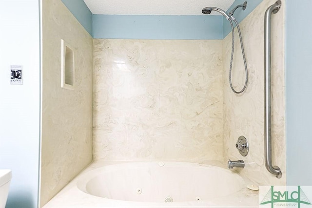 full bath with toilet and a combined bath / shower with jetted tub