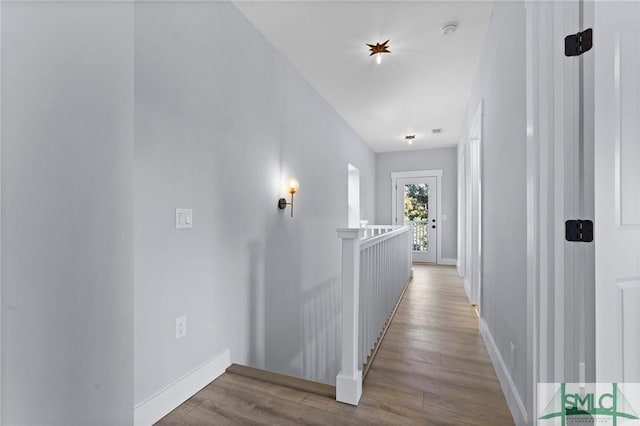 3205 Burroughs St, Savannah, GA 31405 - corridor featuring wood finished floors, an upstairs landing, and baseboards