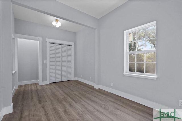 3205 Burroughs St, Savannah, GA 31405 - unfurnished bedroom with wood finished floors, baseboards, and a closet