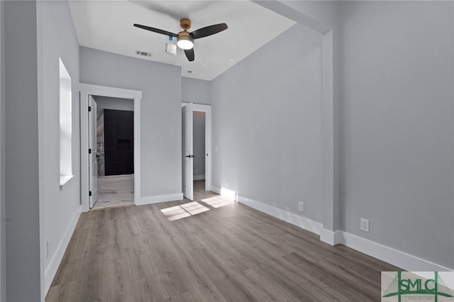3205 Burroughs St, Savannah, GA 31405 - unfurnished bedroom featuring wood finished floors, baseboards, and ensuite bath