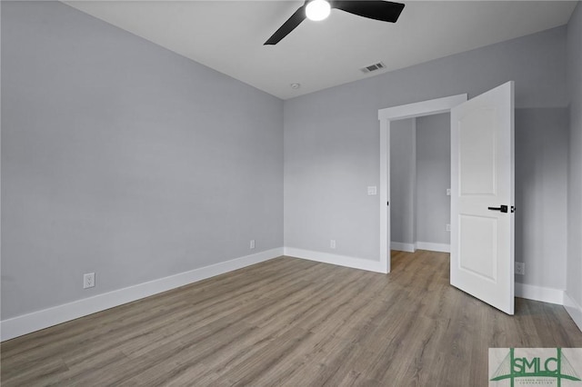 3205 Burroughs St, Savannah, GA 31405 - spare room featuring wood finished floors, ceiling fan, and baseboards