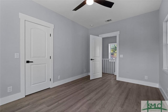 3205 Burroughs St, Savannah, GA 31405 - unfurnished bedroom featuring wood finished floors, baseboards, and a ceiling fan
