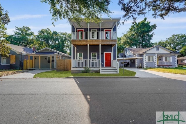 3205 Burroughs St, Savannah, GA 31405 - view of front of property with driveway, a balcony, a porch, and a carport