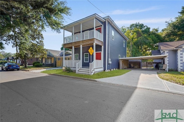 3205 Burroughs St, Savannah, GA 31405 - contemporary home featuring a balcony, driveway, and a detached carport