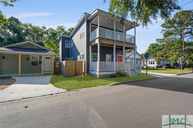 3205 Burroughs St, Savannah, GA 31405 - view of front of house with a balcony, covered porch, and driveway