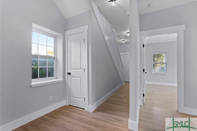 3205 Burroughs St, Savannah, GA 31405 - stairs featuring wood finished floors, baseboards, and vaulted ceiling