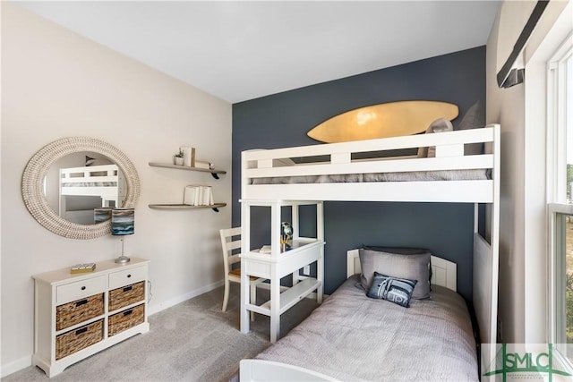 bedroom featuring carpet flooring and baseboards