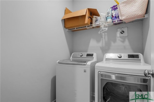 laundry room with independent washer and dryer