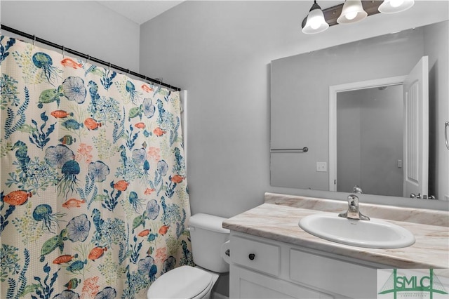 bathroom with vanity, toilet, and a shower with curtain