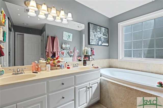 full bath with a garden tub, double vanity, and tile patterned floors
