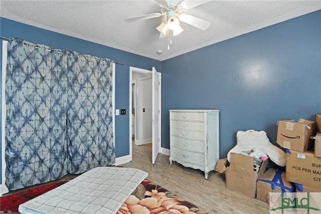 bedroom with wood finished floors and ceiling fan