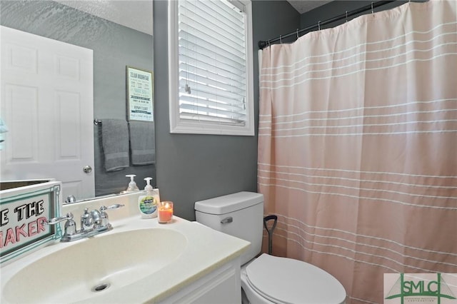 full bathroom with toilet, vanity, and a shower with curtain