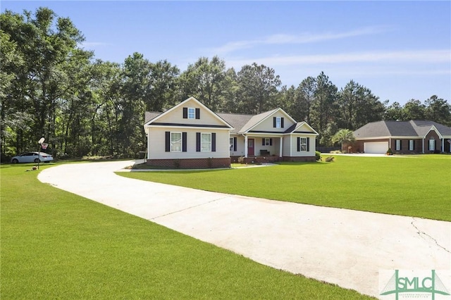 view of front facade with concrete driveway, a front yard, view of scattered trees, and a garage