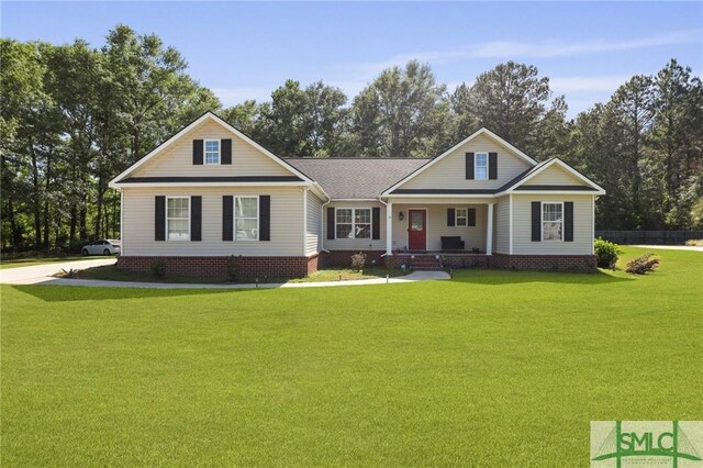 2431 Walden Way, Statesboro, GA 30458 - view of front of home featuring a porch, a front yard, and view of wooded area