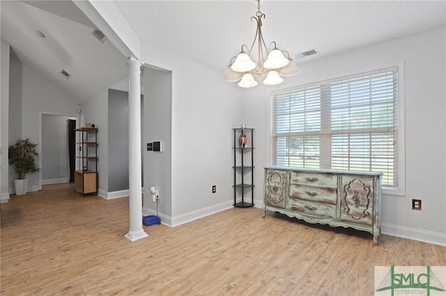 living area featuring ornate columns, a chandelier, baseboards, lofted ceiling, and light wood finished floors