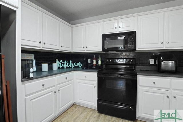 2431 Walden Way, Statesboro, GA 30458 - kitchen featuring black appliances, dark countertops, white cabinetry, and tasteful backsplash