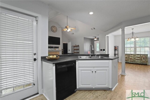 2431 Walden Way, Statesboro, GA 30458 - kitchen featuring dishwasher, a sink, dark countertops, plenty of natural light, and vaulted ceiling