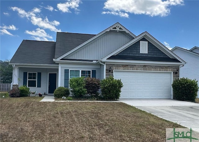 craftsman house with an attached garage, driveway, board and batten siding, a front yard, and stone siding