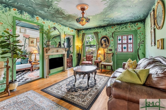 239 Chatham Ave, Pooler, GA 31322 - living room with wallpapered walls, a fireplace, and wood finished floors