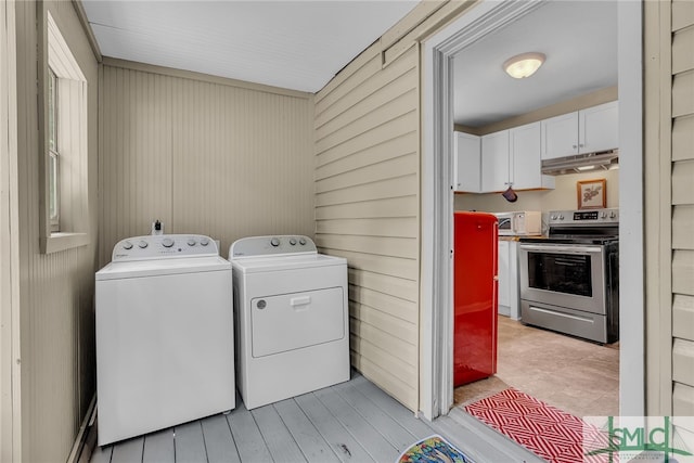 239 Chatham Ave, Pooler, GA 31322 - laundry area with washer and clothes dryer and wooden walls