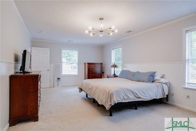 bedroom featuring a chandelier, light colored carpet, multiple windows, crown molding, and a wainscoted wall