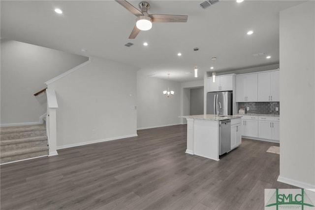 124 Benelli Dr, Pooler, GA 31322 - kitchen featuring open floor plan, appliances with stainless steel finishes, an island with sink, recessed lighting, and decorative backsplash