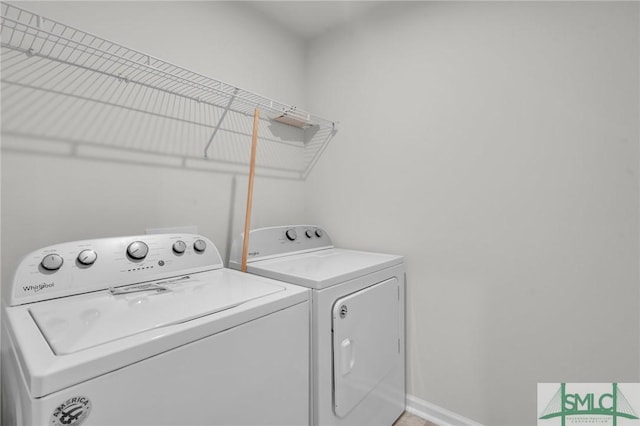 124 Benelli Dr, Pooler, GA 31322 - clothes washing area with washing machine and dryer and baseboards