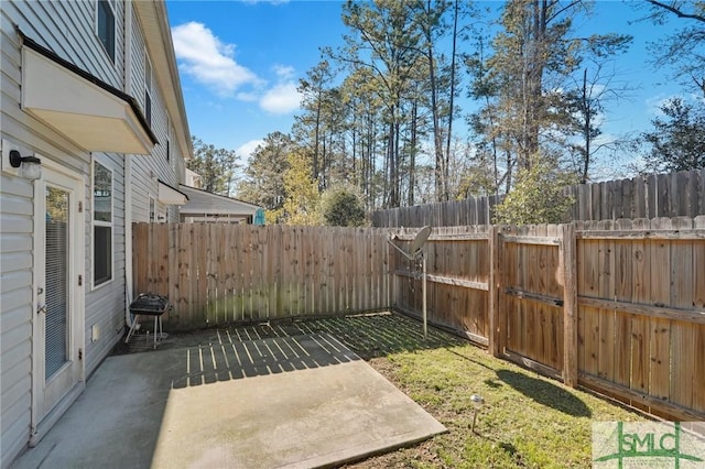124 Benelli Dr, Pooler, GA 31322 - fenced backyard featuring a patio area