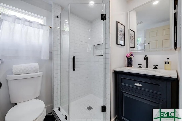 528 E Gordon Ln, Savannah, GA 31401 - bathroom with toilet, a shower stall, and vanity