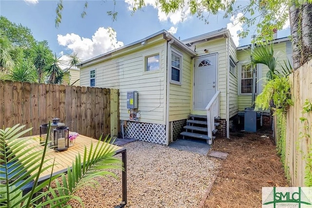 528 E Gordon Ln, Savannah, GA 31401 - back of house featuring entry steps, fence, central air condition unit, and a wooden deck
